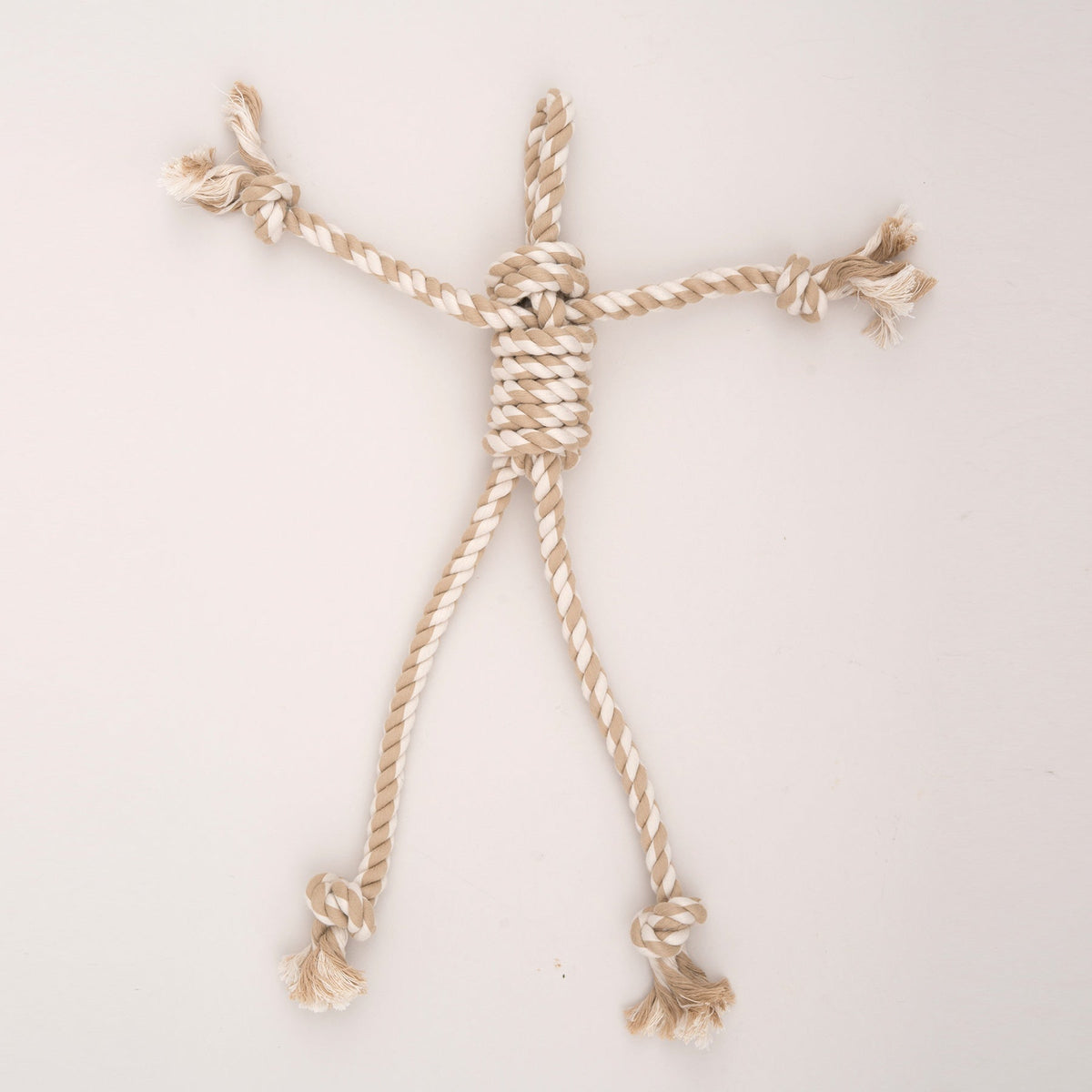 Tan rope brace accessory with knotted ends for the plush dog toy
