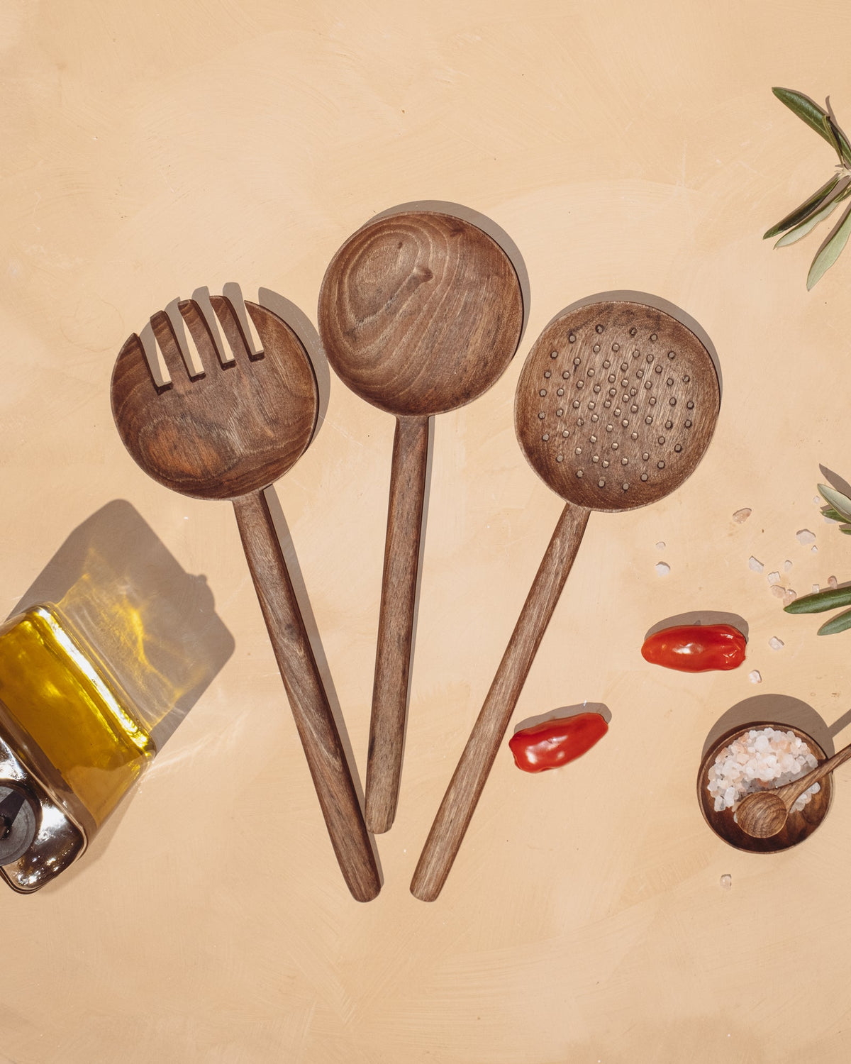 Walnut long-handled spoon set of 3 with round heads in perforated, ribbed, and smooth styles