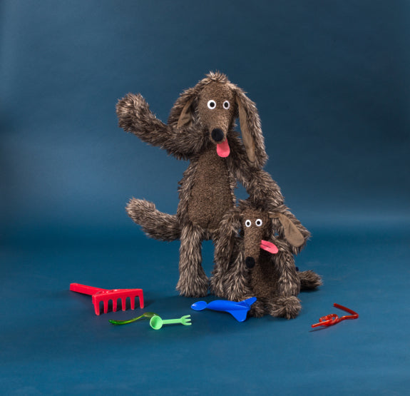 Moulin Roty stuffed dog plush toy standing with pink tongue and floppy ears