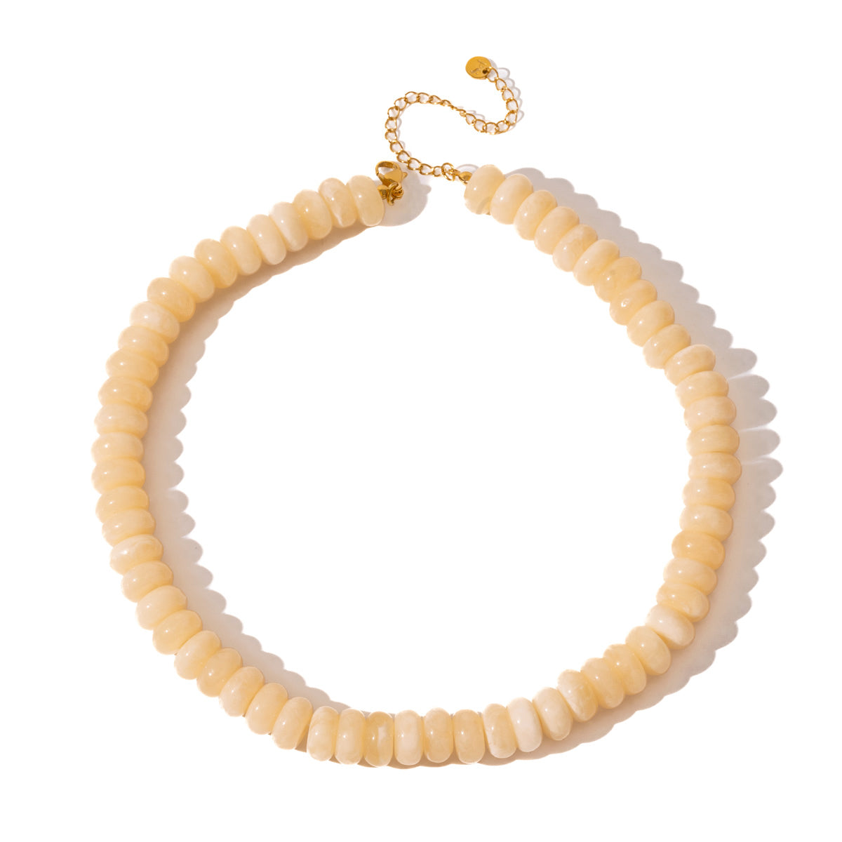 Ivory donut-bead necklace with gold-tone lobster clasp