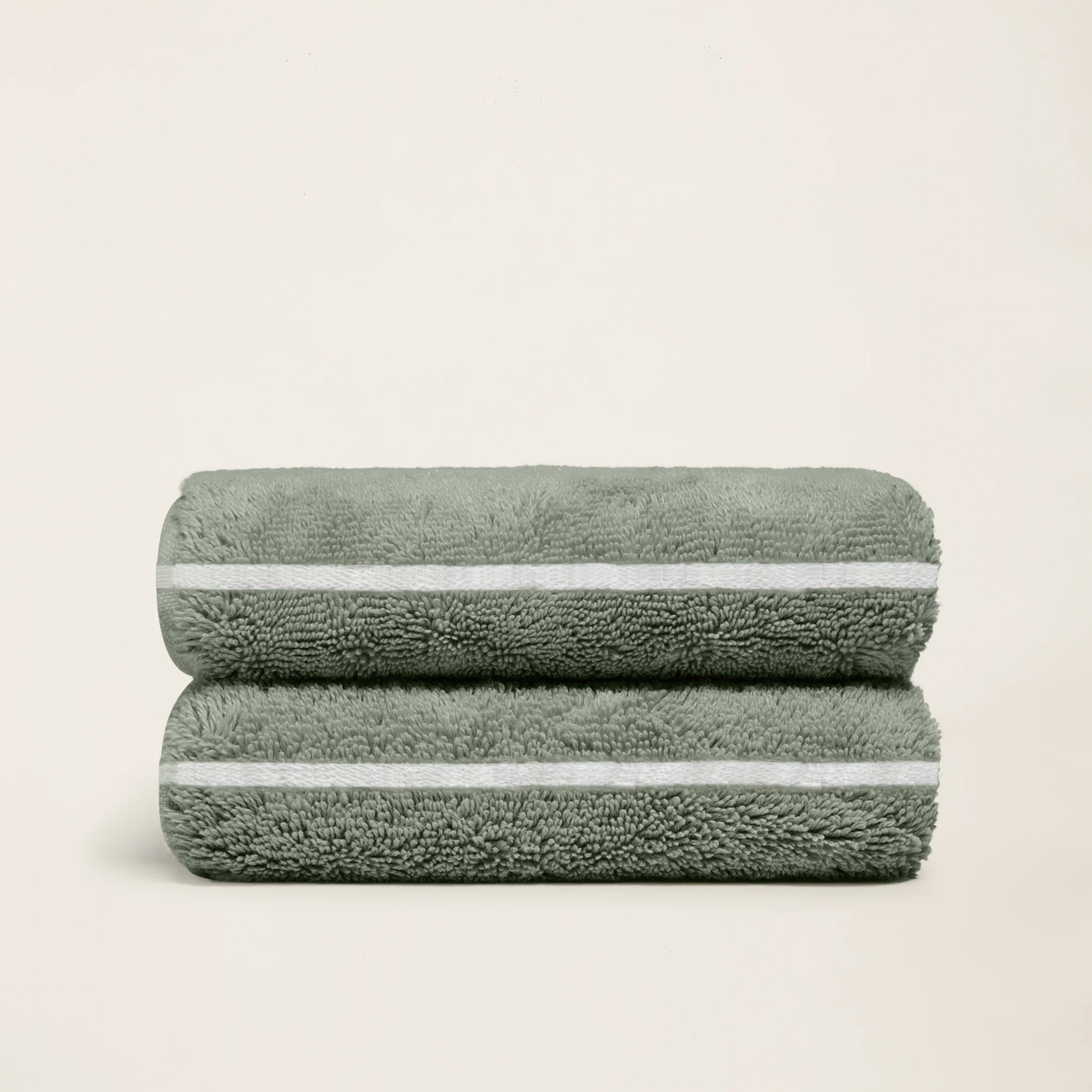 Sage-green cotton towels with white stripe edging, folded stack of 2