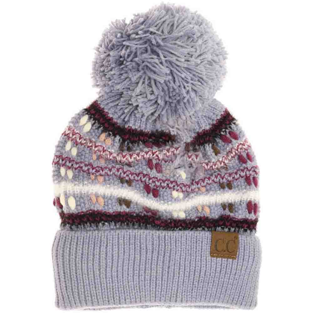 Denim blue knit beanie with large yarn pom-pom, Fair Isle stripe pattern, C.C logo patch