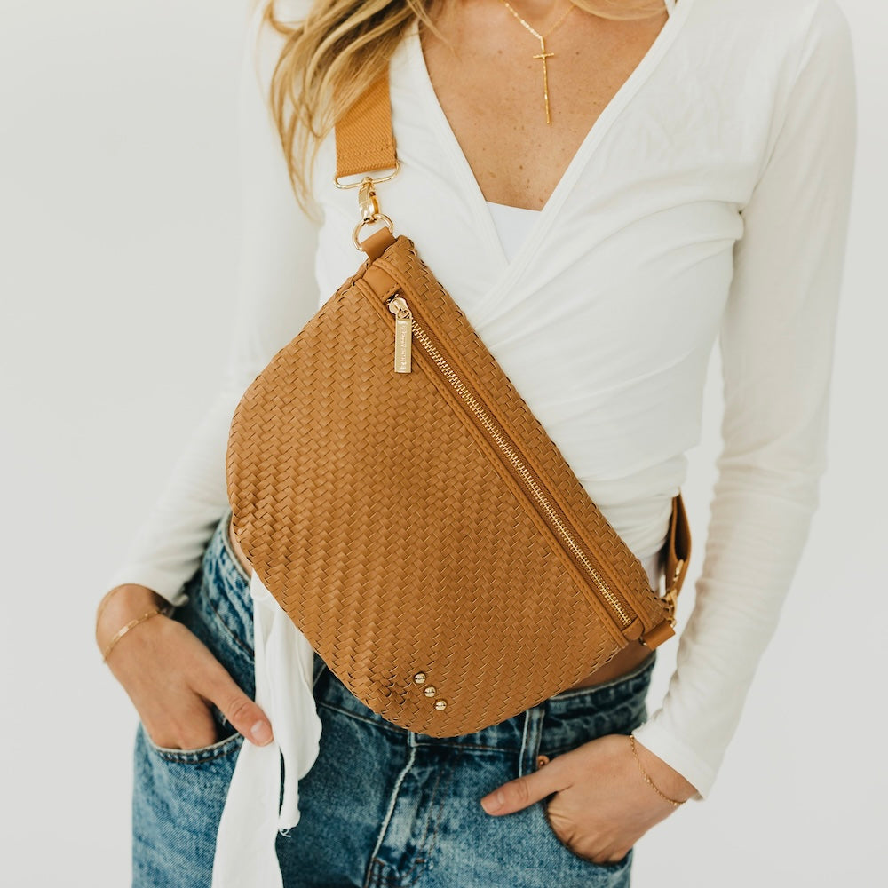 Woven tan brown bum bag with zip top and adjustable crossbody strap