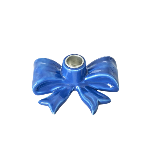 Small blue ceramic bow-shaped candle holder with round metal insert
