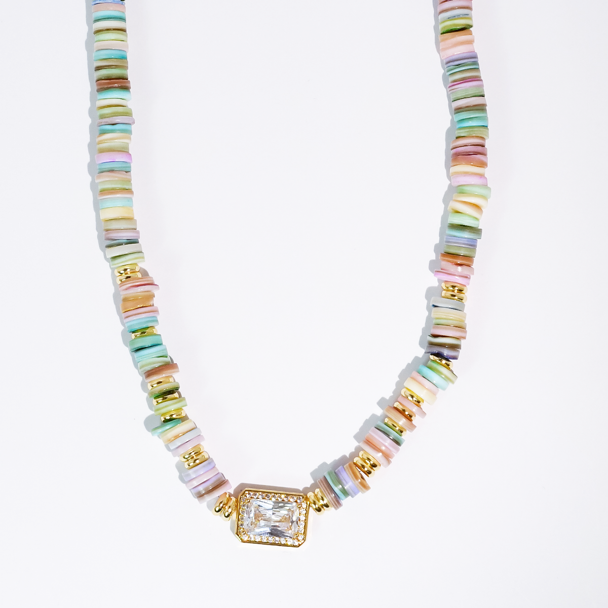Pastel rainbow heishi beaded necklace with gold-toned square gem pendant and striped beads.