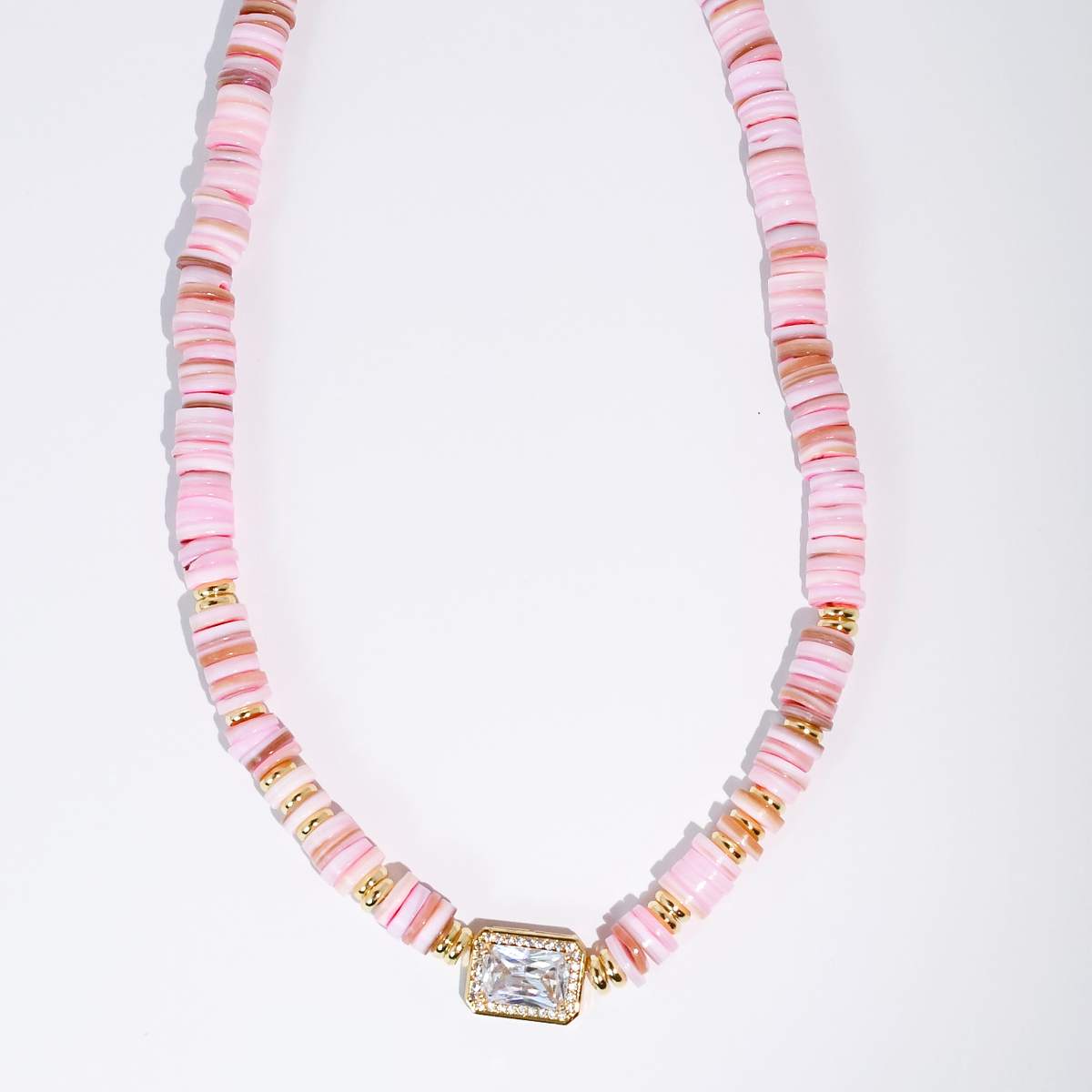 Pastel heishi beaded necklace with gold-toned square gem pendant and pink-striped beads.