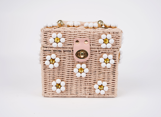 Pink woven handbag with white beaded flowers, gold clasp and top handle