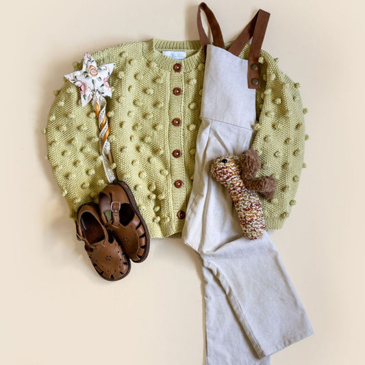 Light yellow cardigan with button-front and textured dot knit