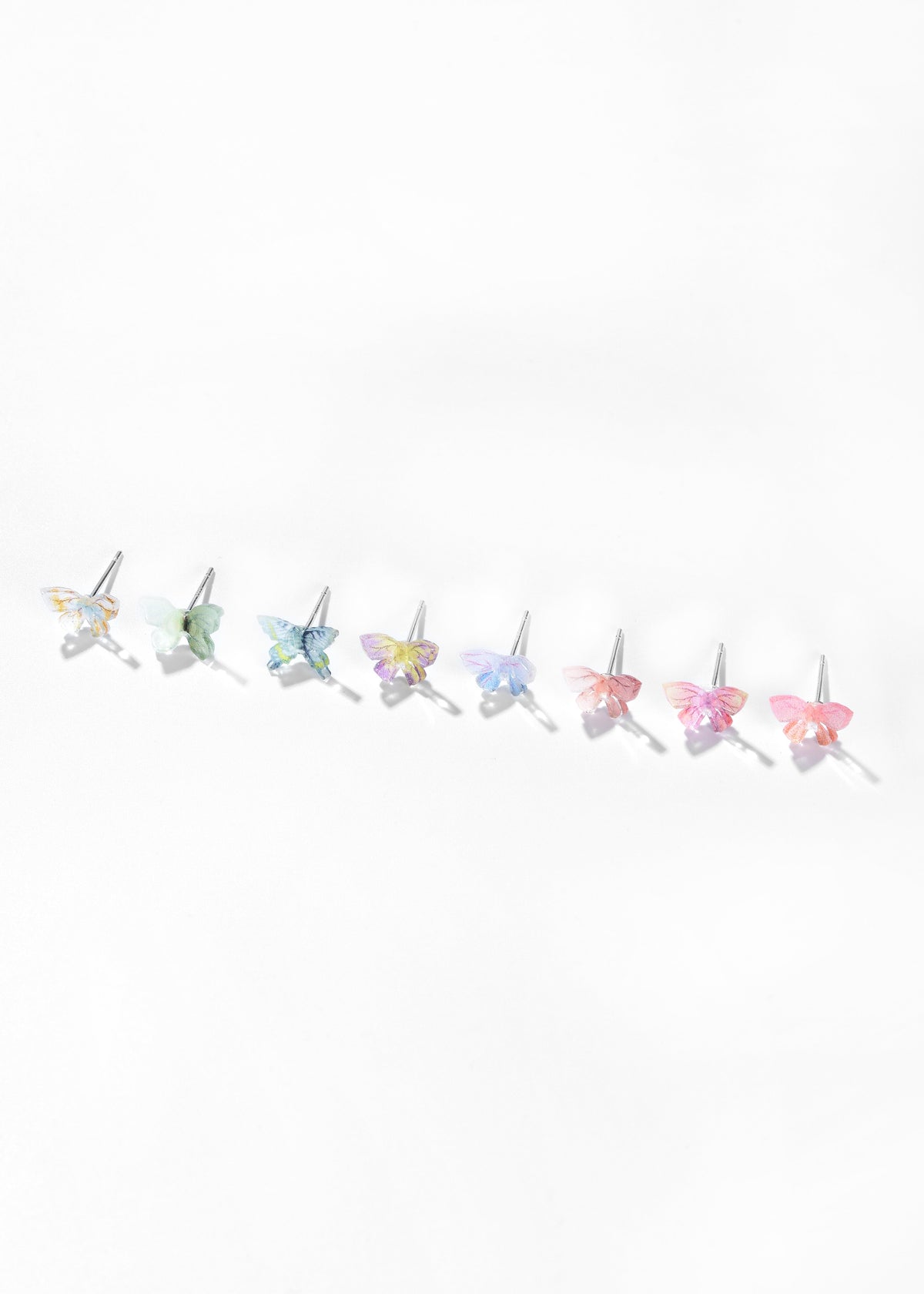 Butterfly stud earrings with iridescent wings in assorted pastel colors.