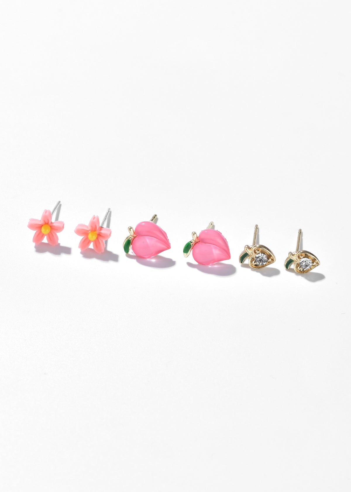Set of three pairs of earrings: pink flowers, pink tulips, and gold-tone heart-shaped studs