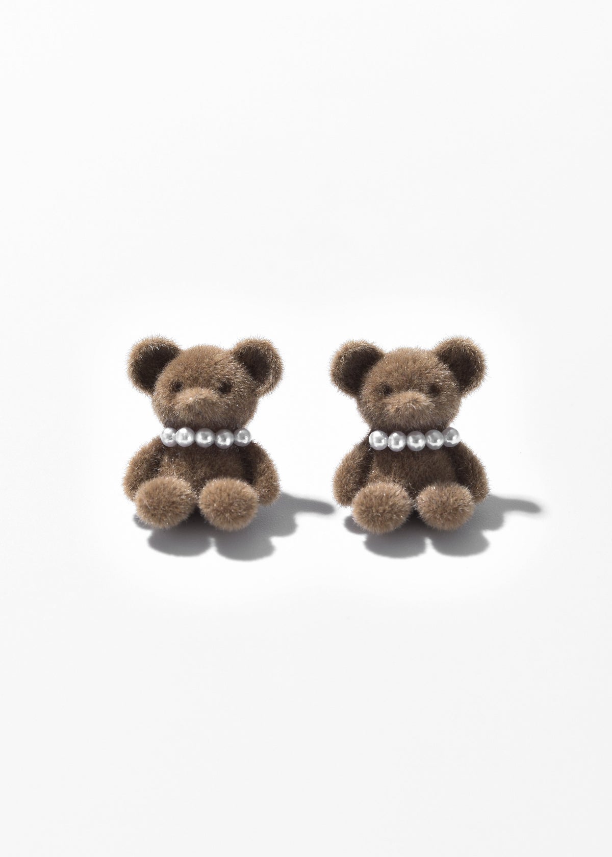 Pair of brown teddy bear earrings with pearl-like collars