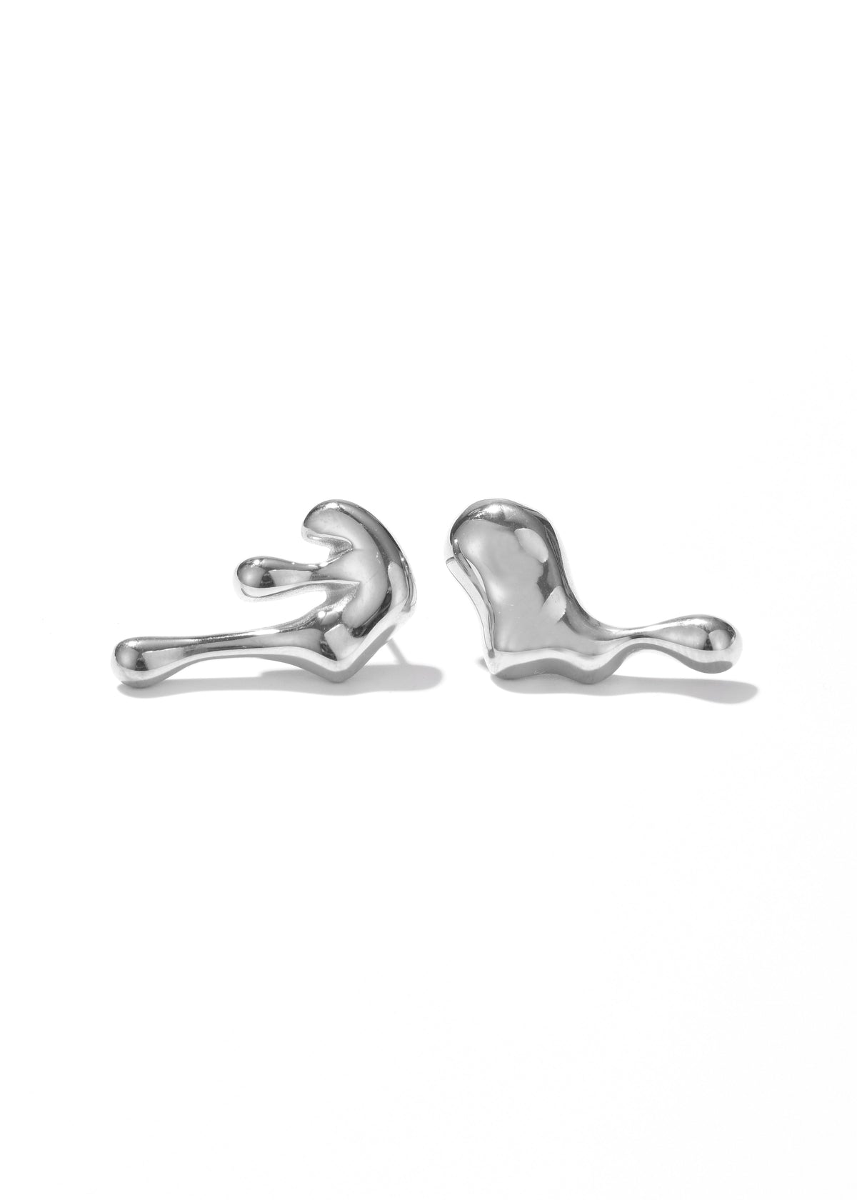 Pair of white gold liquid-style earrings with flowing, sculptural shapes.