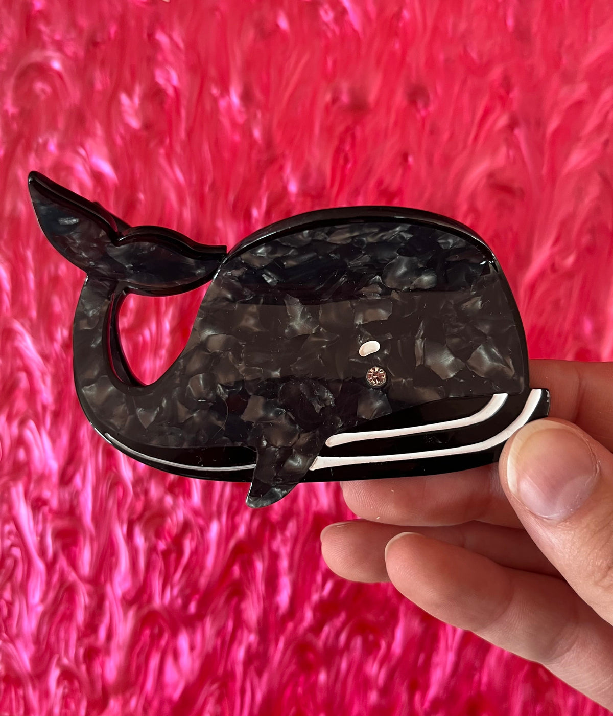 Black whale hair claw with marbled pattern and rhinestone