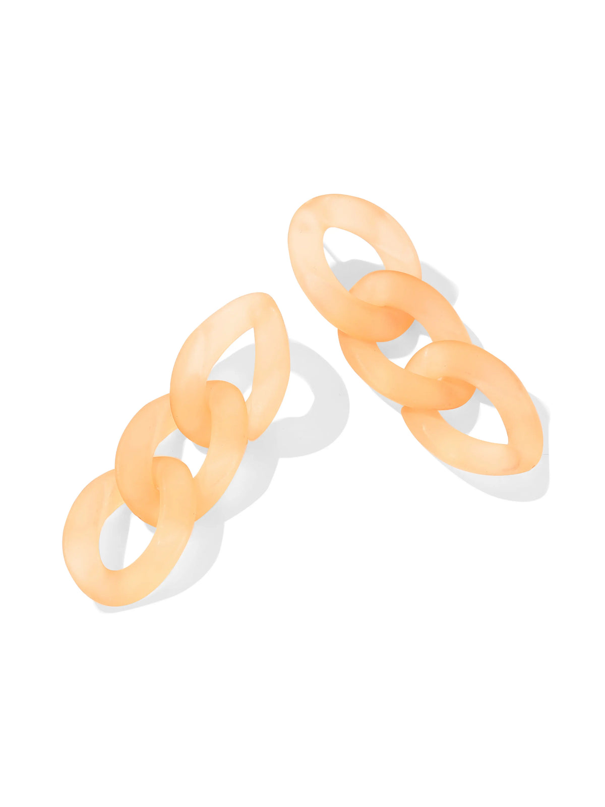 Peach-colored earrings with three interlocking oval hoops