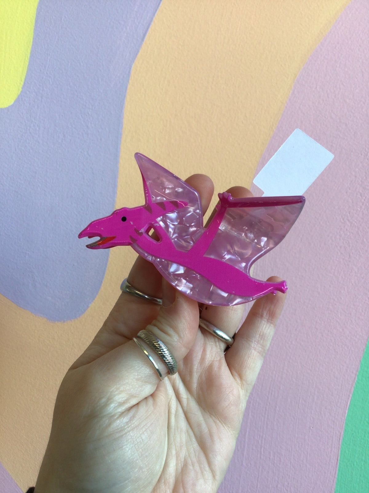 Pink dinosaur hair claw with clear acrylic claws and glossy finish