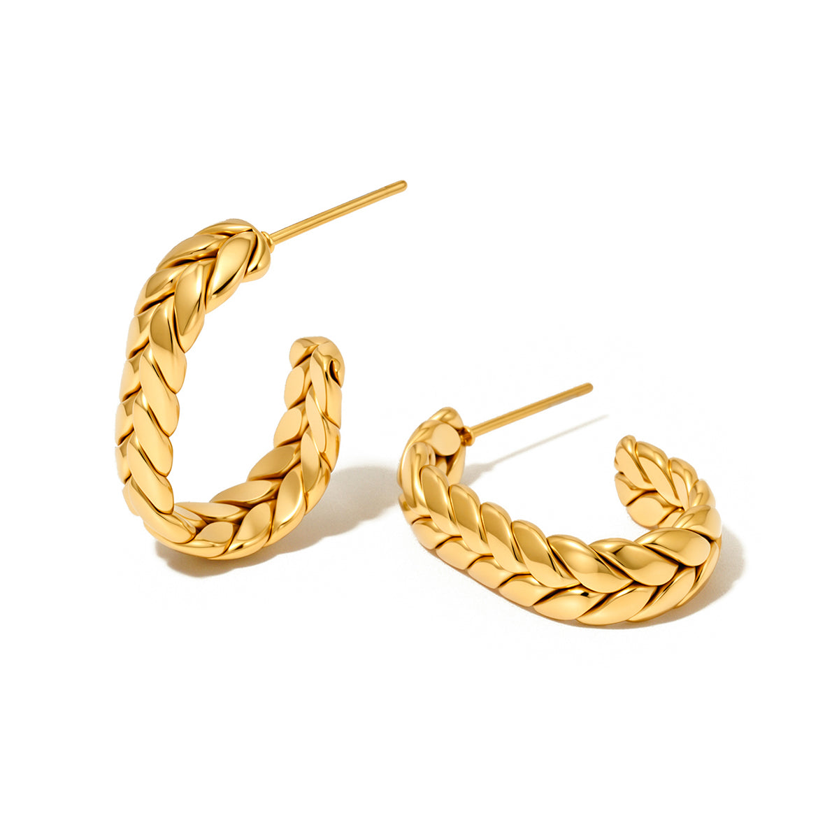 Gold braided oval hoop earrings, angled view with hinge posts.