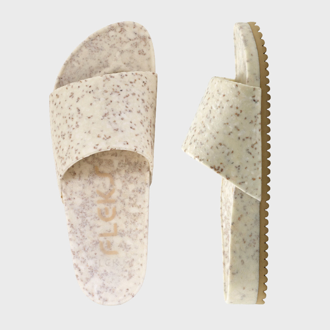 Speckled open-toe slide sandals, contoured strap and ridged tan outsole.