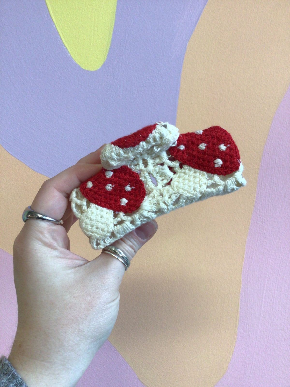 Crocheted hair claw with cream base and red heart-shaped applique