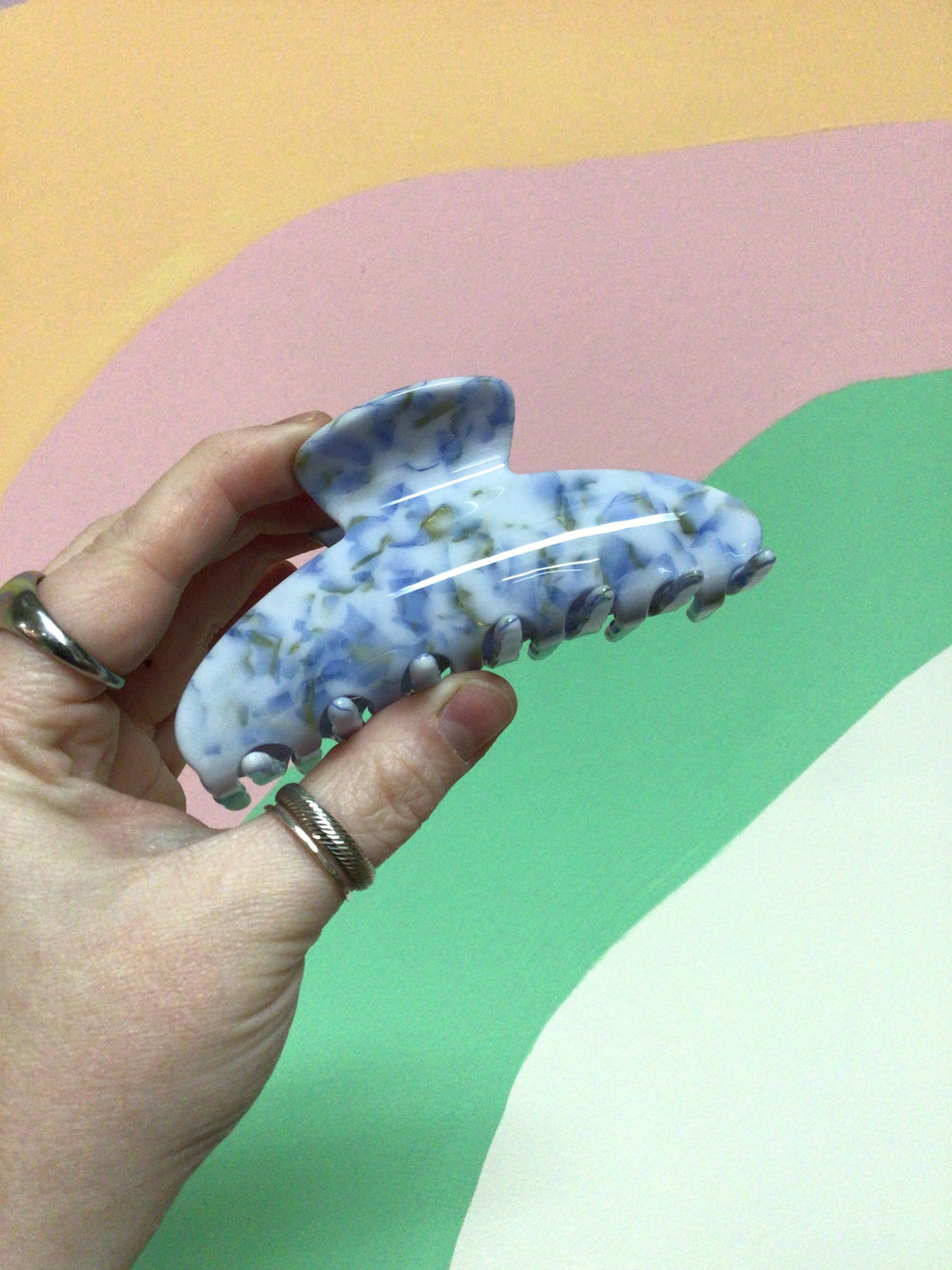 Crescent hair claw, blue marbled speckle with mint-green accents