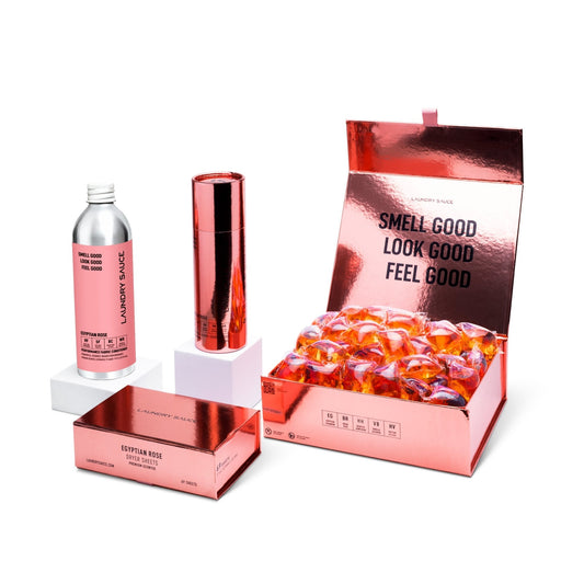Scent package set with bottle, metallic spray can, and open gift box with wax melts