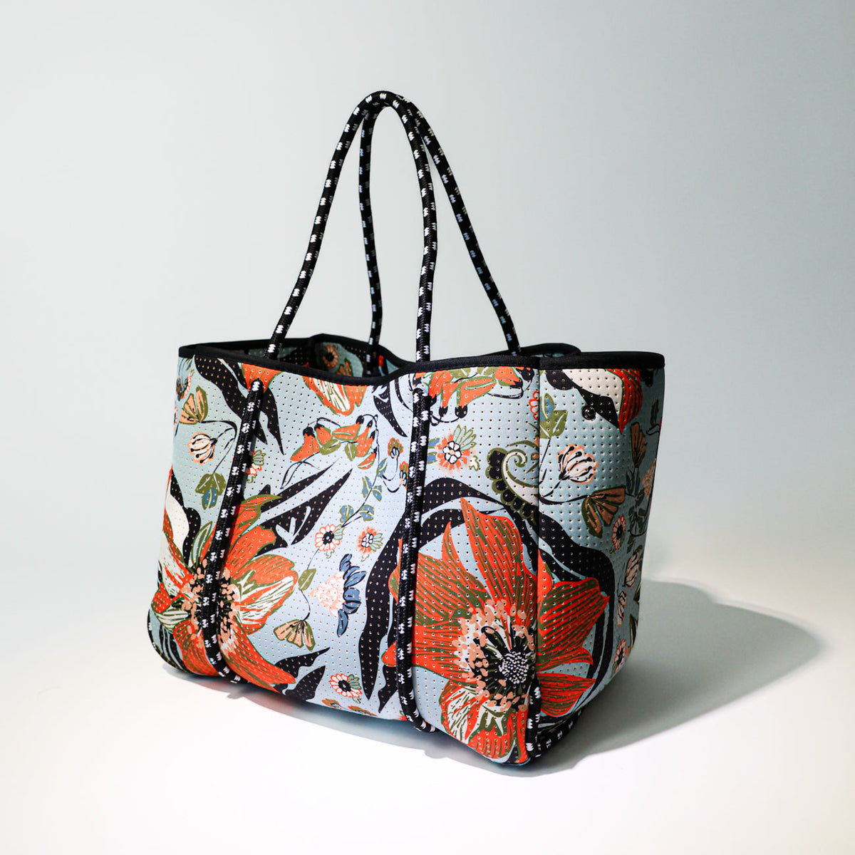 Floral print everyday tote bag with black trim and long top carry handles