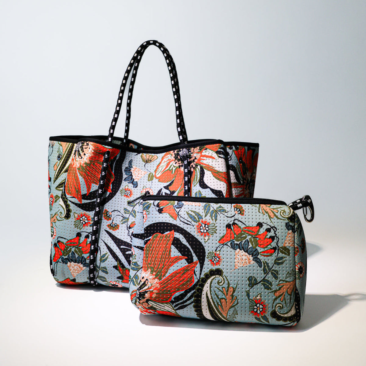 Printed floral tote bag with matching front zip pouch and black dotted handles