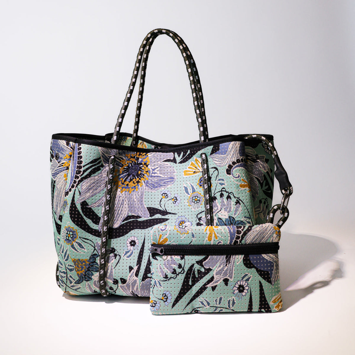 Mint floral zip-top tote with matching pouch, black trim, and striped handles