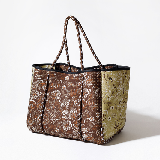 Paisley tote bag with striped handles and dark top rim; brown center with olive side