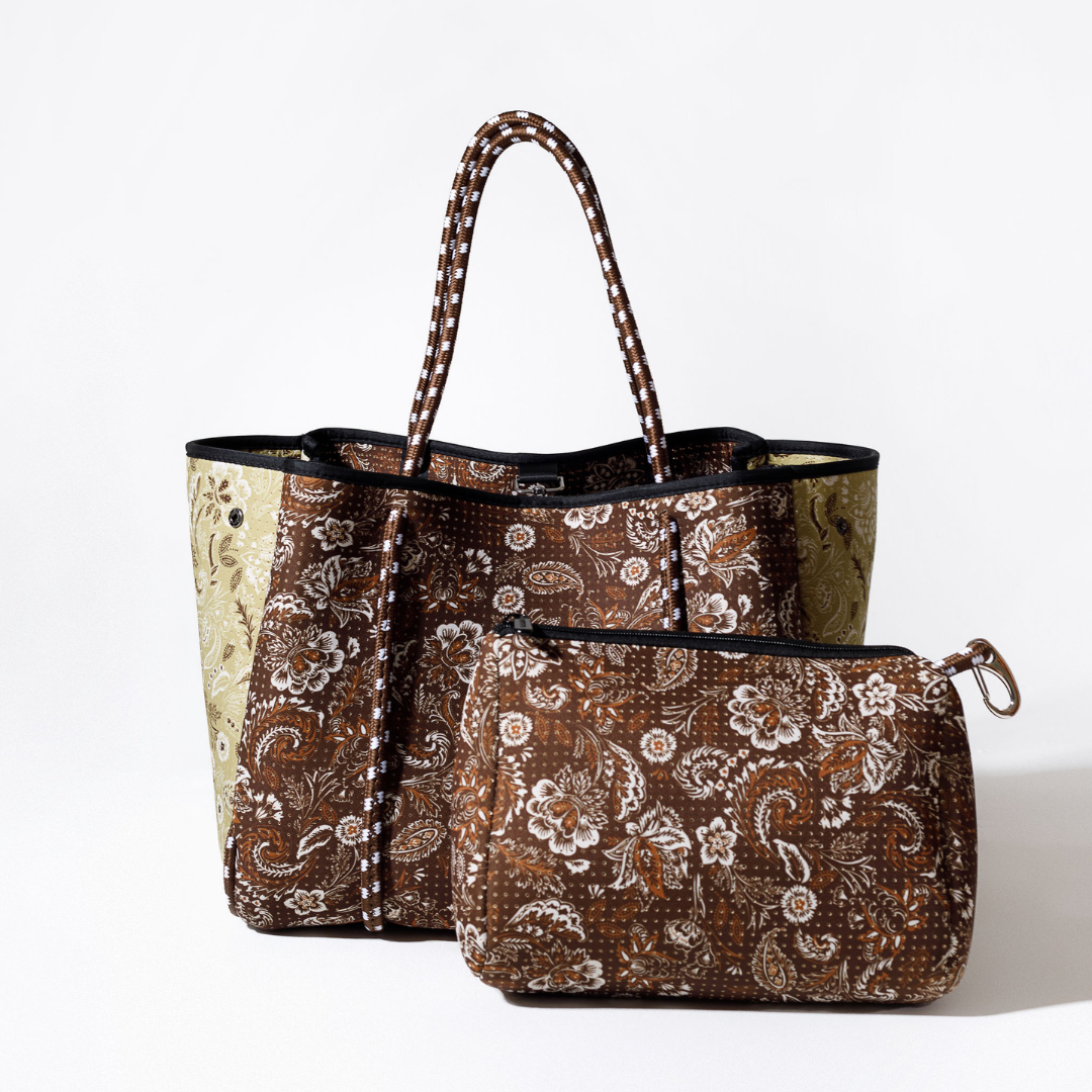 Paisley tote bag with striped handles and dark trim, paired with zip pouch