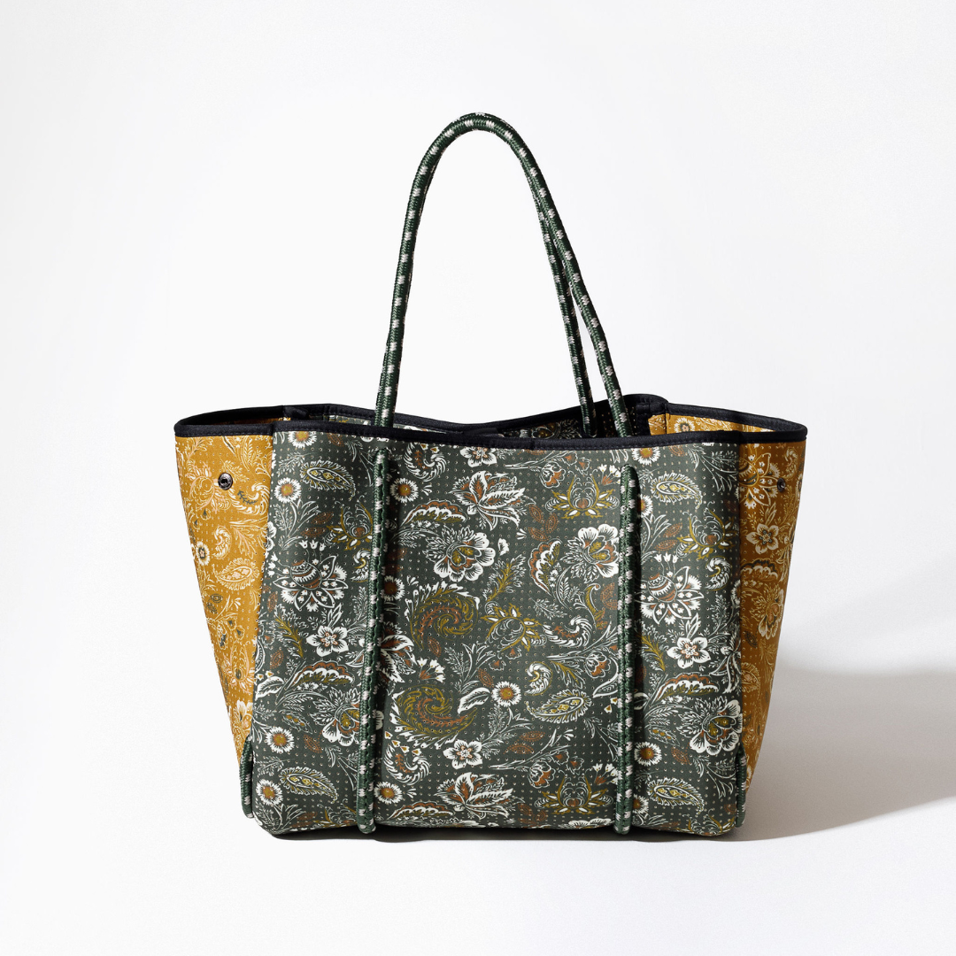 Paisley tote bag with forest-green pattern, black trim, and sturdy top handles