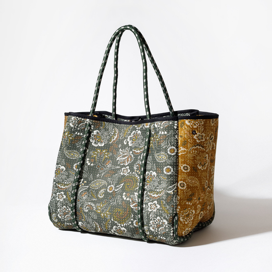 Two-tone paisley tote bag in dark green and gold with black trim and long handles