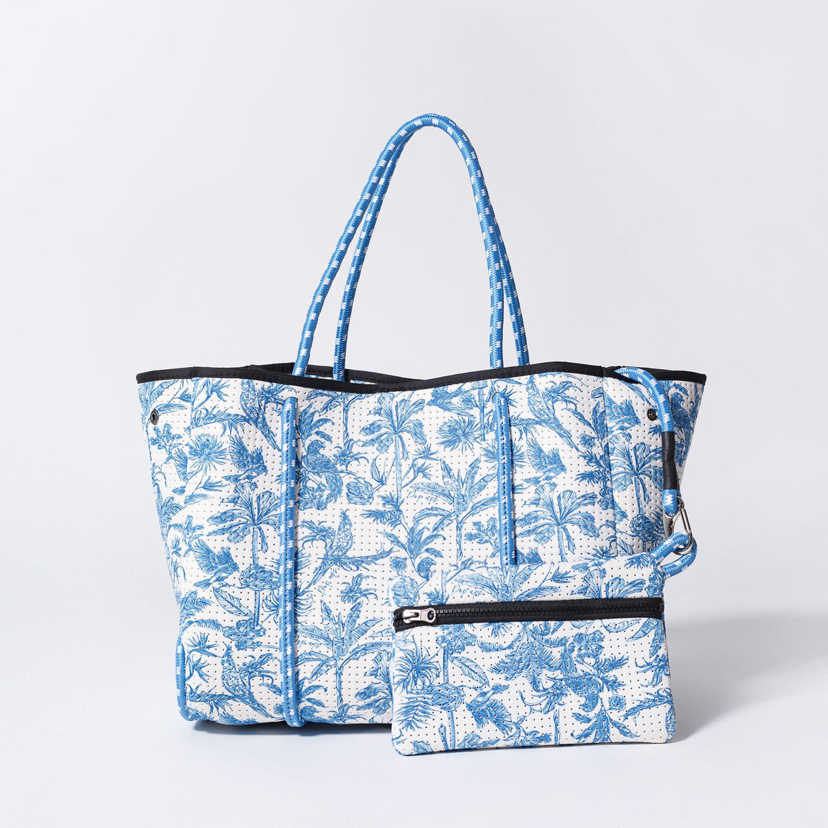 Tote bag with matching zip pouch, blue and white tropical print, black trim