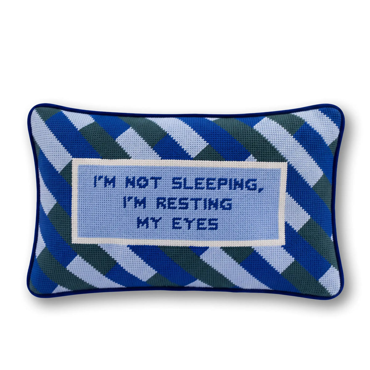 Needlepoint resting eyes pillow with blue geometric pattern and stitched message
