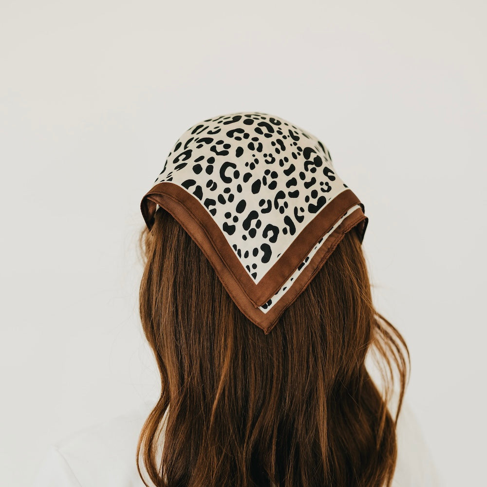 Leopard print square scarf headwear with brown V trim at the front