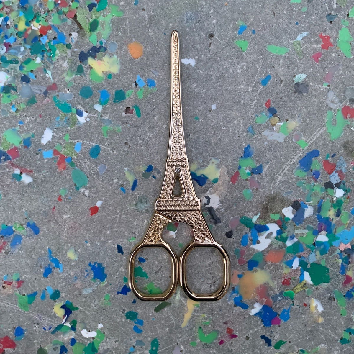 Eiffel Tower mini scissors with detailed Eiffel Tower handle, antique gold metal, two finger loops.