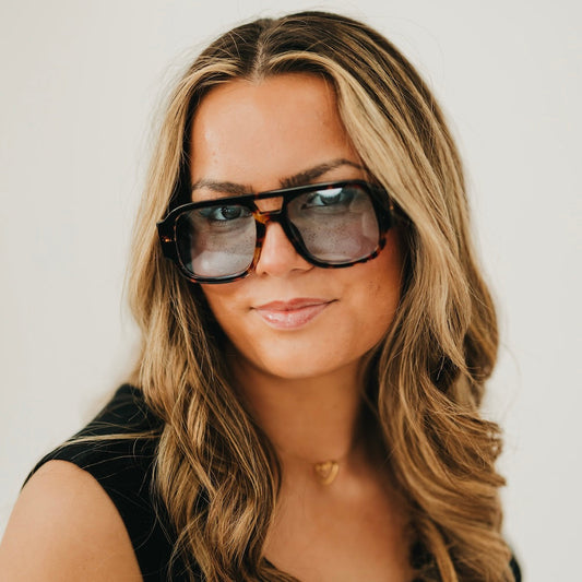 Retro square pilot sunglasses with dark tortoise frame and amber-orange tinted lenses