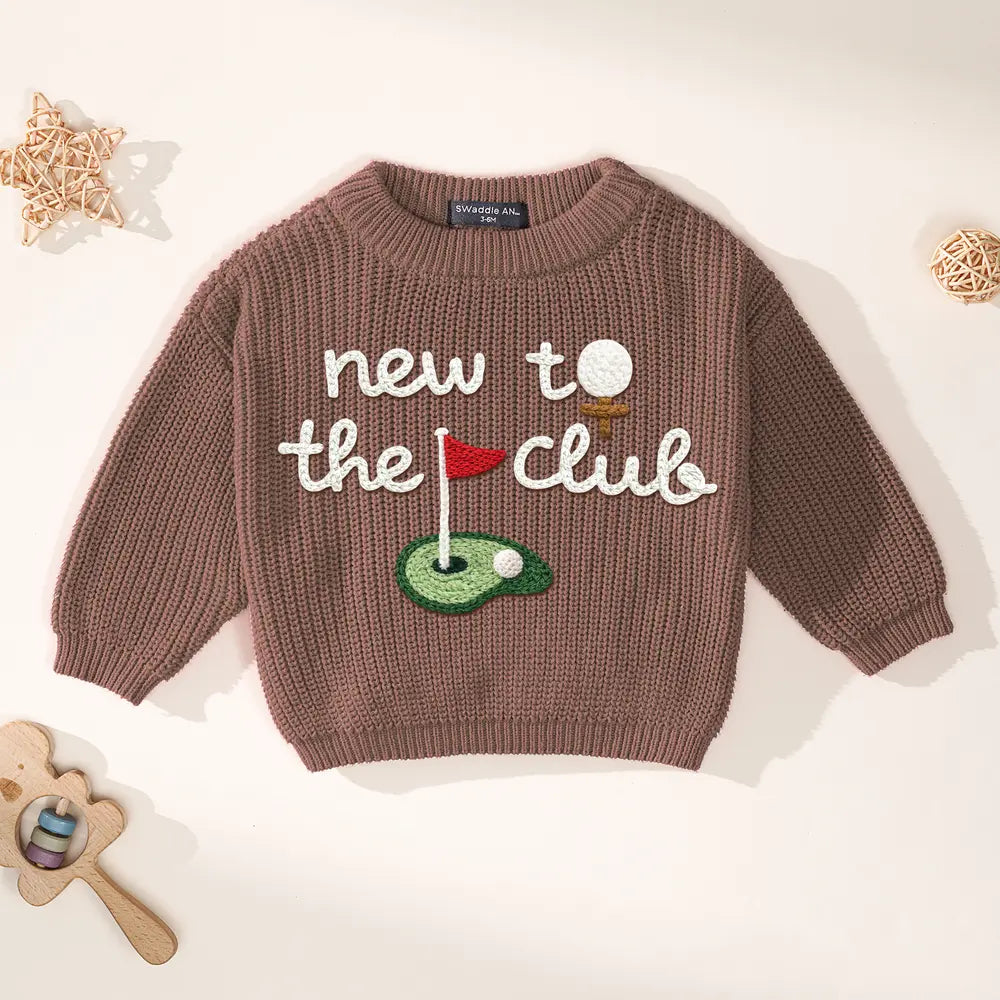 Mocha brown knit golf sweater with 'new to the club' embroidered golf flag design