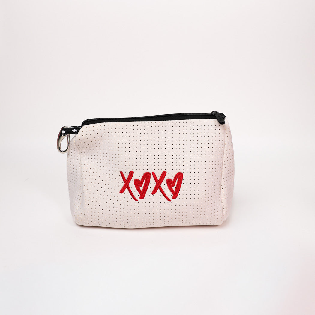 White perforated pouch with black zipper and red XOXO graphic