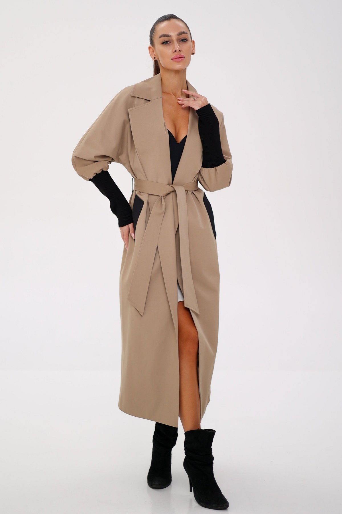 Miru camel trench coat with wide lapels and a tied belt, worn open