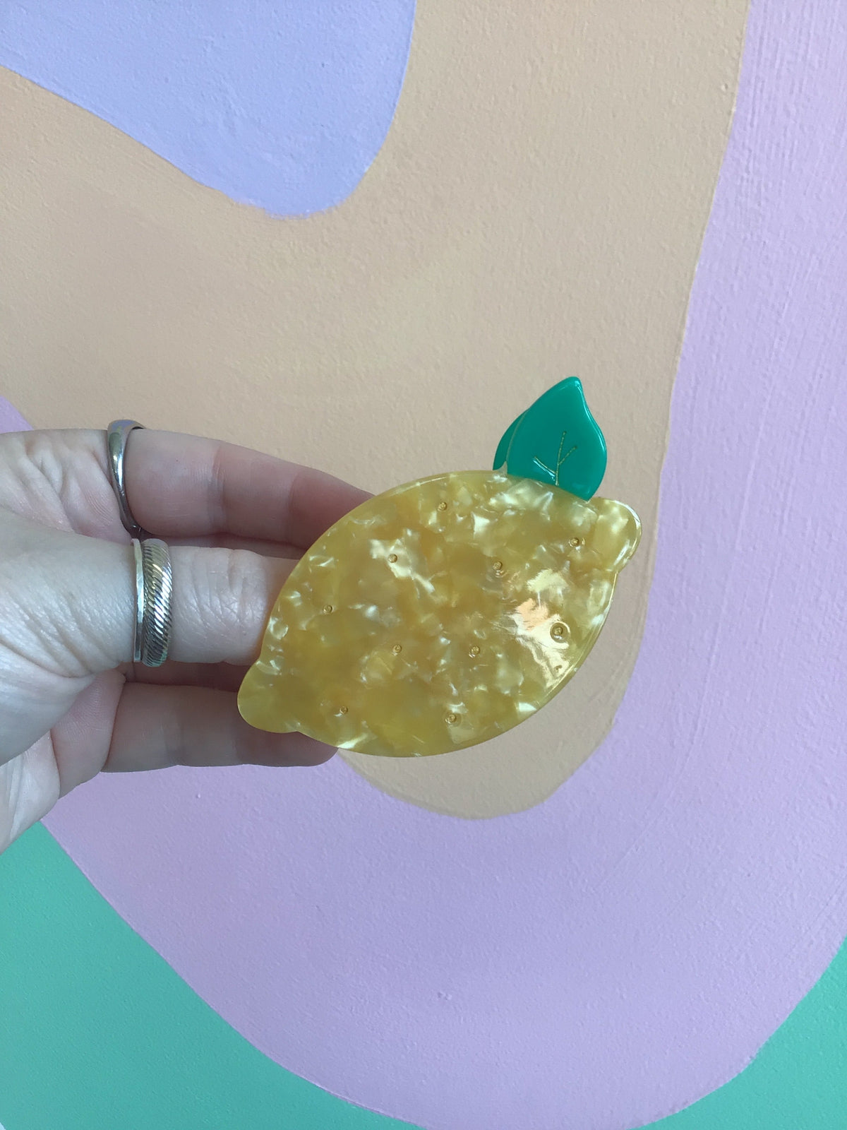 Green apple fruit hair claw with leaf detail and curved snap grip