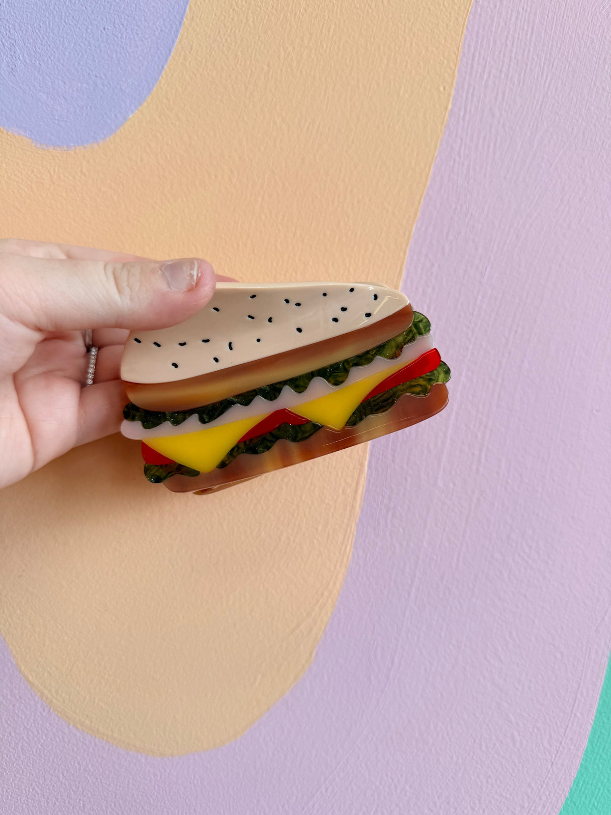 Cheeseburger food hair claw with lettuce, tomato, and melted cheese