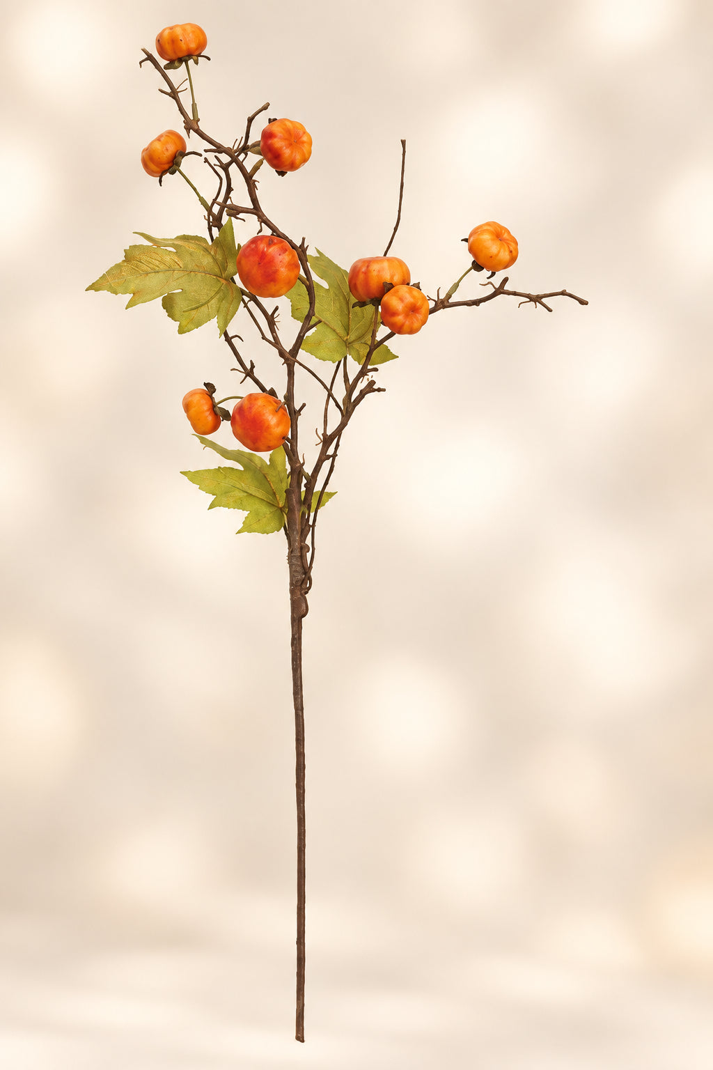 Orange faux pumpkin spray on long stem with clustered pumpkins and green leaves