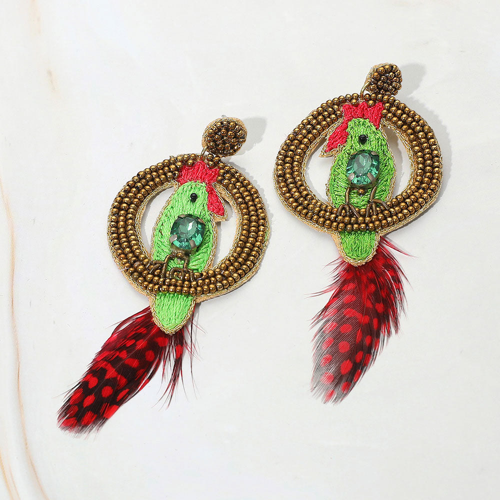 Green embroidered parrot earrings with gold beaded hoop and red feather drops