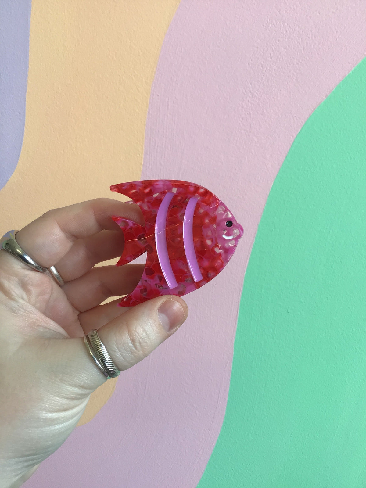 Ocean-themed hair claw with red fins and small purple fish face