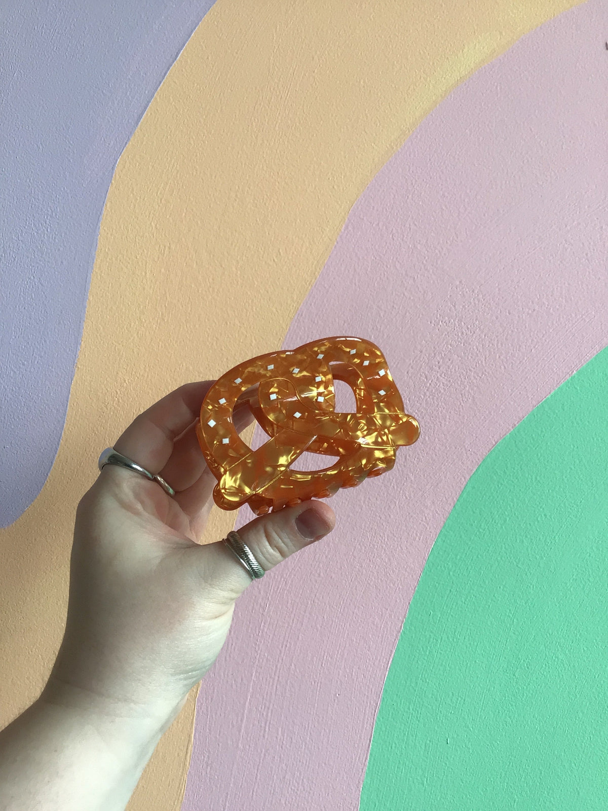 Golden cheese wedge food hair claw with speckled texture