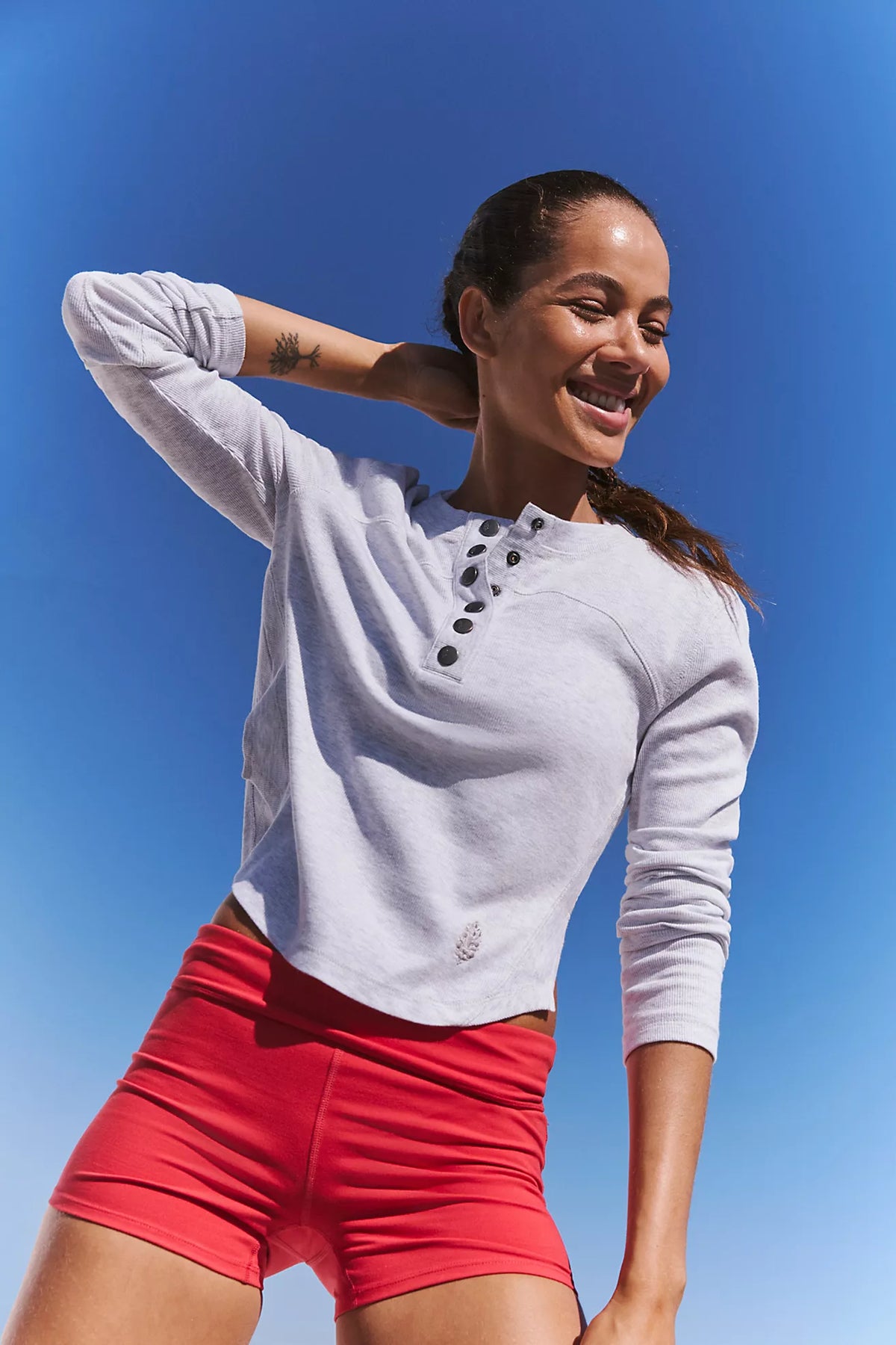 Heather gray long-sleeve henley top with button placket and crew neckline