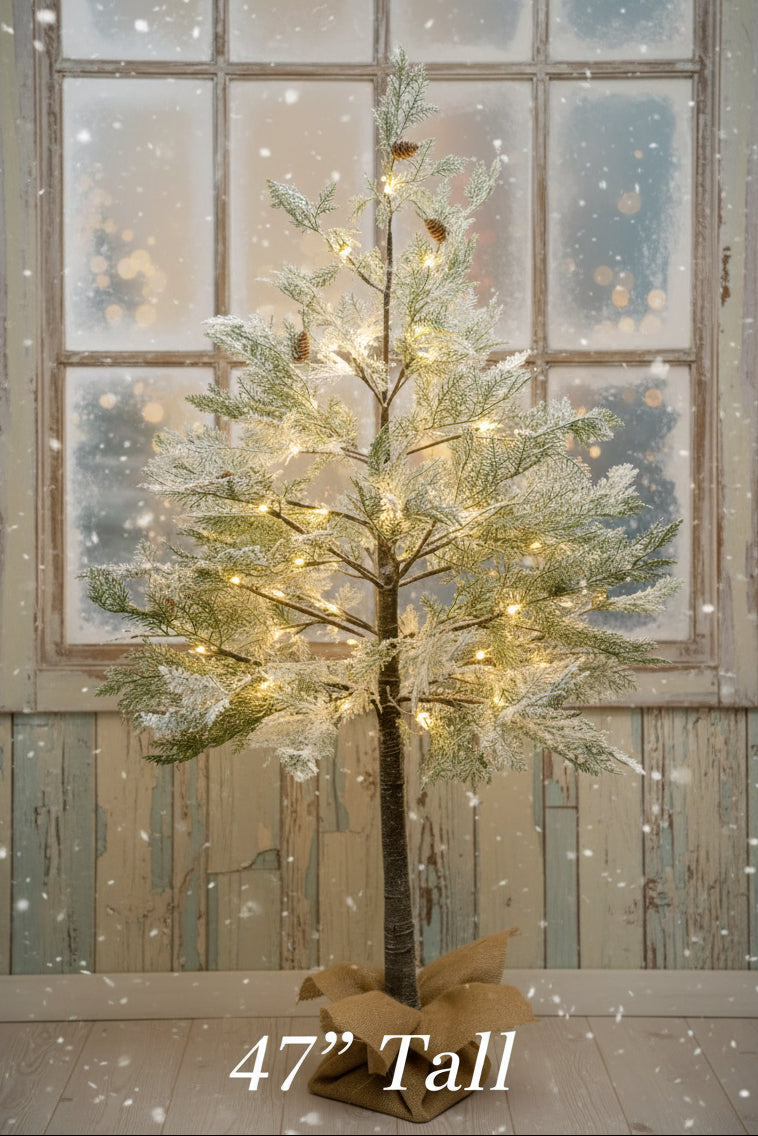 Lighted flocked cedar tree, 47-inch tall, warm white lights on branches