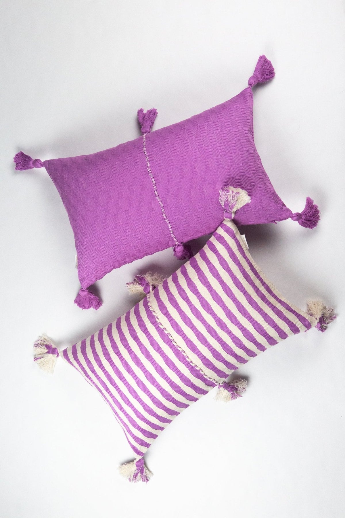 Orchid pillow set: striped and solid covers with corner tassels