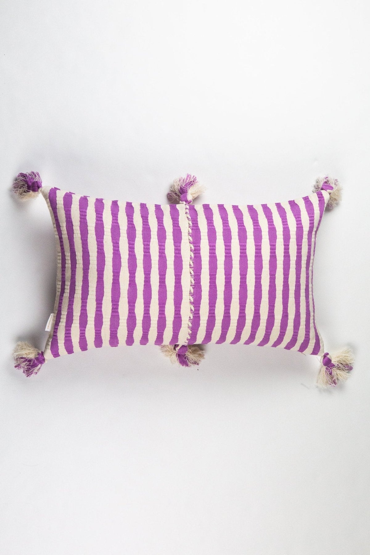 Orchid striped pillow cover with corner tassels and center seam