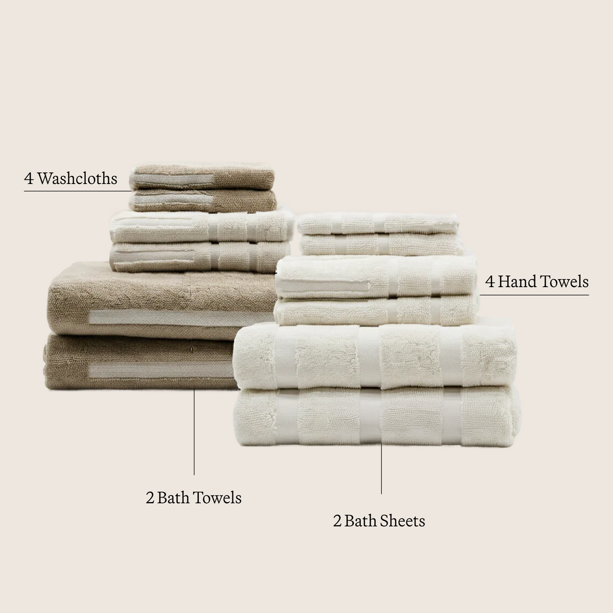 Assorted cotton towel stacks in ecru and tan with contrasting stripe bands